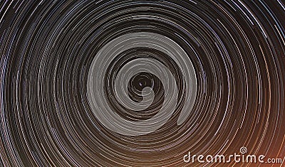 Cumulative timelapse of star trails in night sky. Stock Photo