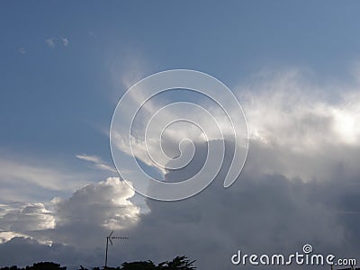 Cumulonimbus Cloud dissipates above the Salt Marshes at Guerande in France Stock Photo