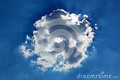 Cumulus cloud with sun beams Stock Photo