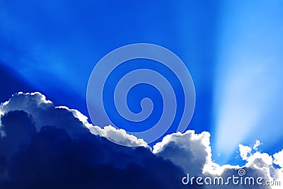 Cumulus clouds with sunbeams Stock Photo