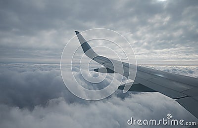 The cumulus clouds under the airplane window. Russia Stock Photo