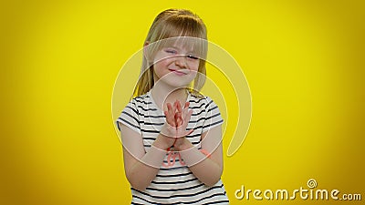 Cunning sneaky playful child girl with tricky face gesticulating and scheming evil plan, joke, prank Stock Photo