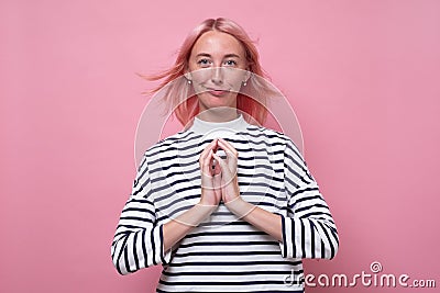 Cunning woman indenting to realize tricky plan. Stock Photo