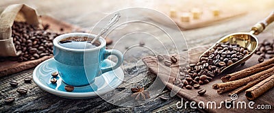 A cup of aromatic black coffee and coffee beans on the table. Morning Coffee Espresso for breakfast in a beautiful blue cup Stock Photo