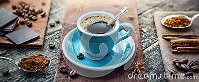 A cup of aromatic black coffee, a coffee maker, coffee beans of different varieties on the table. Morning espresso or Americano Stock Photo