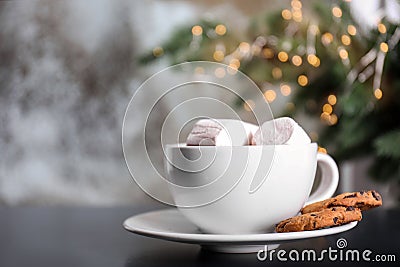 Cup of aromatic cacao with marshmallows and cookies on table, closeup Stock Photo