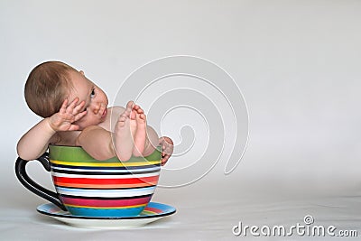 A Cup of Baby Stock Photo