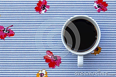 A Cup of Black Coffee on Cloth with Seamless Blue Horizontal Stripes and Colorful Flowers Pattern Stock Photo