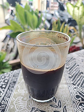 Cup of black coffee on coffee table in bright atmosphere Stock Photo