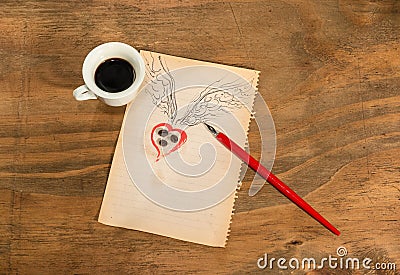 Cup of black coffee with coffee beans heart with wings drawn in pencil and red rose . Stock Photo