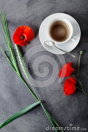 Cup of black coffee set with wild flowers - poppies, on grey grunge background Stock Photo