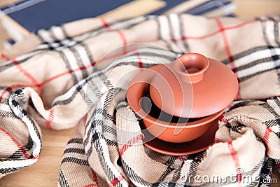 A cup of black tea and books wrapped in a scarf Stock Photo