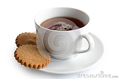 A cup of black tea with two gingerbread biscuits isolated on white. White ceramic cup and saucer. Stock Photo