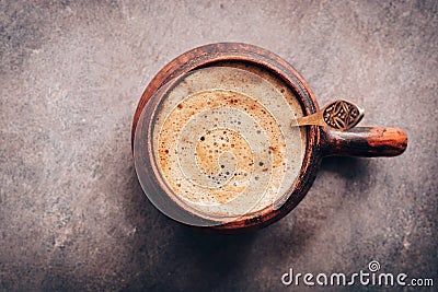 Cup of cappuccino coffee close-up on a dark vintage background. View from above Stock Photo