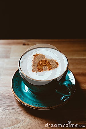 Cup of cappuccino coffee decorated cinnamon heart symbol Stock Photo