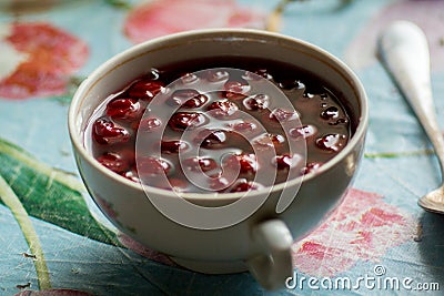 Cup with cherry compote Stock Photo