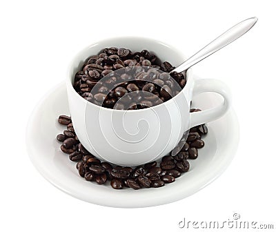 Cup of coffee beans and spoon Stock Photo
