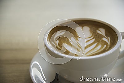 Cup of coffee with beautiful Latte art.how to make latte art coffee Stock Photo