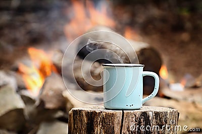 Cup of Coffee by a Campfire Stock Photo