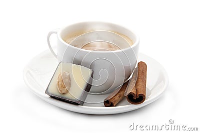 Cup of coffee with chocolate candy and cinnamons Stock Photo