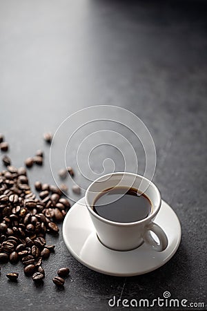 Cup of coffee with coffee beans with interesting light Stock Photo