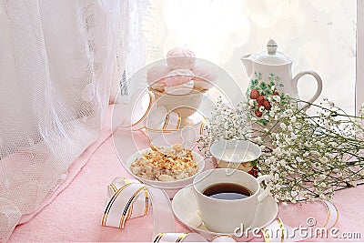 A cup of coffee and a cup of milk on the morning table near the window Stock Photo