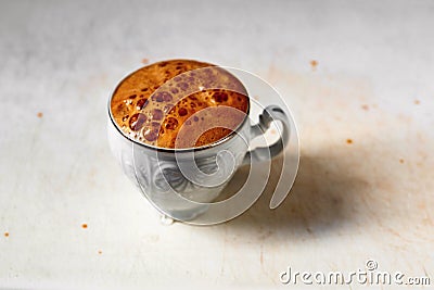 Cup of coffee with foamy bubble cap Stock Photo