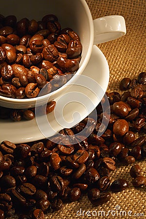 Cup of coffee, full of beans. Stock Photo