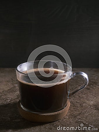 Cup of coffee with fume on the wooden background Stock Photo