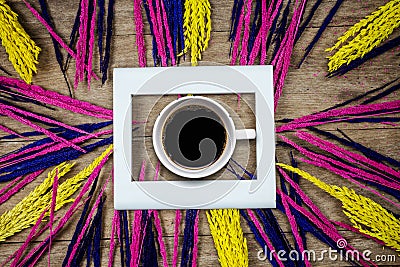 Cup of coffee and grass flowers Stock Photo