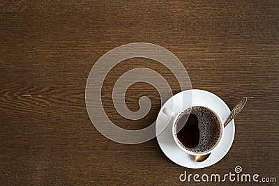 Cup of coffee on a grunge wooden table background Stock Photo