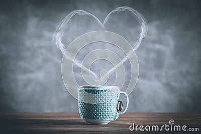 Cup of coffee with a heart shaped steam Stock Photo