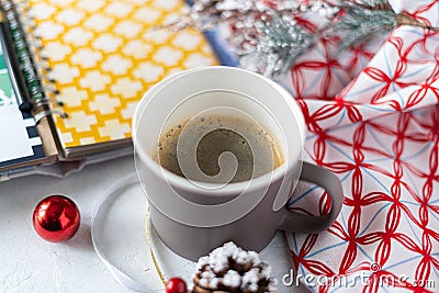 Cup of coffee, holiday decorations, cone and notebook, christmas planning concept. Happy new year Stock Photo