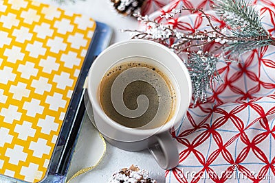Cup of coffee, holiday decorations, cone and notebook, christmas planning concept. Happy new year Stock Photo