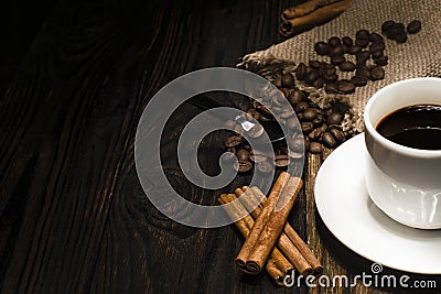 Cup of coffee and ingredients on a wooden background Stock Photo