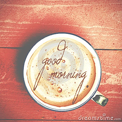 Cup of coffee latte, cappuccino on a pink wood table. Words good Stock Photo