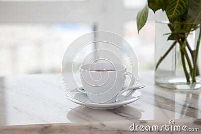 Cup of coffee on marble table Stock Photo