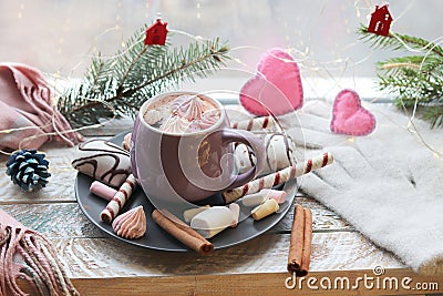 Cup of coffee with meringues and dessert on a plate, Christmas decor, hearts on the windowsill Stock Photo