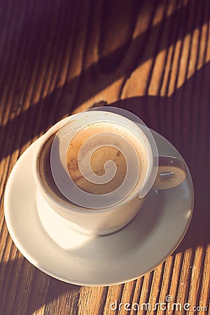 Cup of coffee with milk, top view. Coffee break time. Coffee shop. White cup of coffee on the wooden table Stock Photo