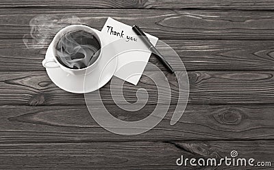 A cup of coffee, a napkin with an inscription thanks Stock Photo