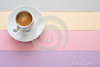Cup of coffee on pastel color background. Summer flat-lay . Stock Photo
