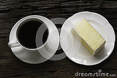 A cup of coffee and a piece of coconut cake Stock Photo