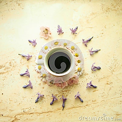 A cup of coffee with spring flowers Stock Photo