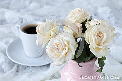 Cup of coffee on a table with flowers Stock Photo