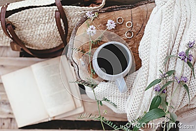 Relaxing and reading in the garden. Summer hygge scene. Stock Photo