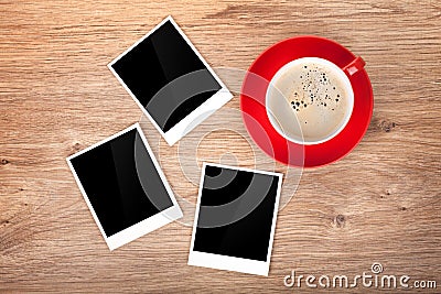 Cup of coffee and three photo frames Stock Photo