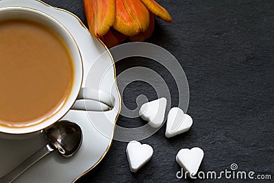 Cup of coffee with tulip and sugar heart valentine breakfast Stock Photo