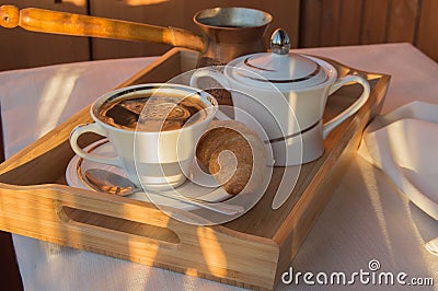 Cup of coffee, Turk, croissants on wooden plate closeup. Breakfast, Selective focus Stock Photo