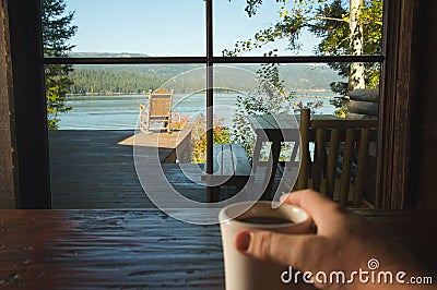 Cup of Coffee and View Of Lake Stock Photo