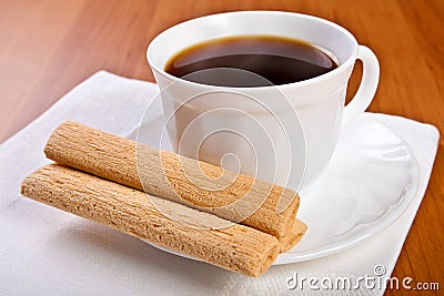 Cup of coffee with waffle cream puff. Stock Photo